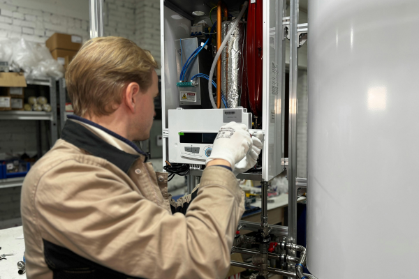 Plumber servicing a water heater